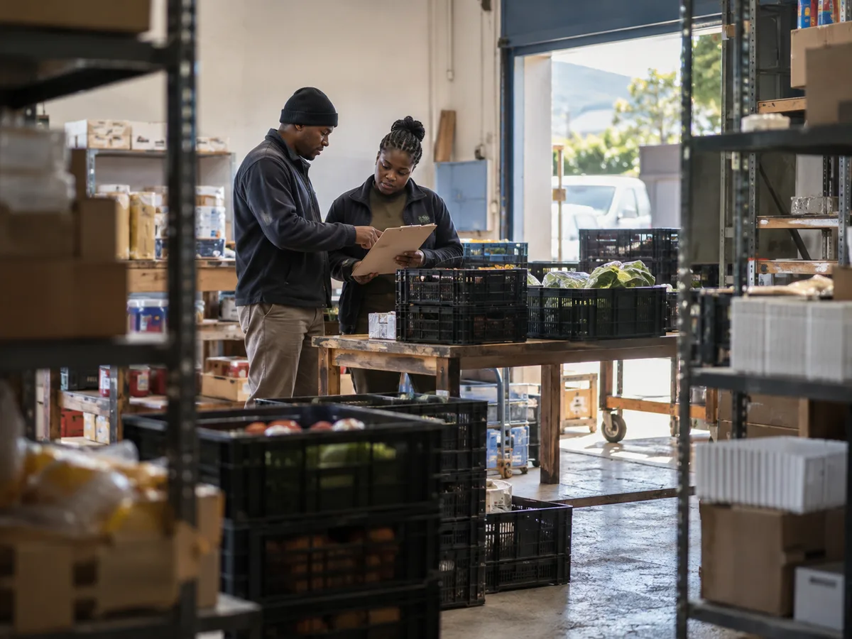 Illustrative staff comparing deliveries for different business locations